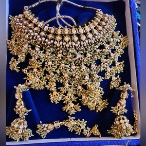 Beautiful set with green stones and gold colour throughout.